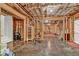 Spacious unfinished basement with open layout, exposed beams, and concrete floor at 5335 Davenport Mnr, Cumming, GA 30041