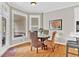 Bright breakfast nook with hardwood floors, wicker chairs, and lots of natural light at 5335 Davenport Mnr, Cumming, GA 30041