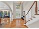 Gracious foyer boasting hardwood floors, soaring ceilings, and an abundance of natural light at 5335 Davenport Mnr, Cumming, GA 30041