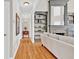 An inviting living room with fireplace, hardwood floors and built-in bookshelves at 5335 Davenport Mnr, Cumming, GA 30041