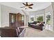 Cozy sitting room with lots of natural light and comfortable seating at 5335 Davenport Mnr, Cumming, GA 30041