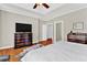 A spacious main bedroom with a ceiling fan, and hardwood floors at 5335 Davenport Mnr, Cumming, GA 30041