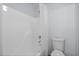 Clean bathroom with a combined bathtub and shower and a white toilet at 6131 Windflower Dr, Powder Springs, GA 30127