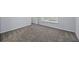 The empty bedroom is spacious, has neutral carpeting, and is ready for your personal touch at 6131 Windflower Dr, Powder Springs, GA 30127