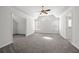 Spacious bedroom with vaulted ceilings, carpet floors, large windows and plenty of natural light at 6131 Windflower Dr, Powder Springs, GA 30127