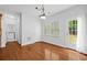 Bright breakfast nook with hardwood floors, natural light, and easy access to laundry and the backyard at 6131 Windflower Dr, Powder Springs, GA 30127