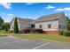 A community clubhouse with adjacent parking and manicured landscaping at 6131 Windflower Dr, Powder Springs, GA 30127
