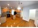 Well-appointed kitchen with wood cabinets, stainless steel appliances, and a convenient island at 6131 Windflower Dr, Powder Springs, GA 30127