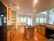 Modern kitchen with granite countertops, stainless steel appliances, and a spacious center island at 6131 Windflower Dr, Powder Springs, GA 30127