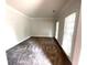 Open living room with neutral paint, lots of windows, and plush carpet throughout at 6131 Windflower Dr, Powder Springs, GA 30127