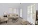 Bright living room featuring neutral furniture, modern art, and lots of natural light at 6131 Windflower Dr, Powder Springs, GA 30127