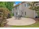 A patio with a table, umbrella, and basketball net outside the home at 6131 Windflower Dr, Powder Springs, GA 30127