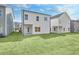 New construction home featuring a rear view showing newly installed sod and an entrance door to the home at 1215 Elowen Dr, Austell, GA 30168