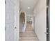 Inviting entryway with hardwood floors, staircase, and view of the kitchen at 1215 Elowen Dr, Austell, GA 30168