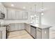 Kitchen features stainless steel appliances, granite countertops, and ample storage space at 1215 Elowen Dr, Austell, GA 30168