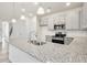 Modern kitchen island with stainless steel sink and breakfast bar at 1215 Elowen Dr, Austell, GA 30168