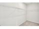 Bright walk-in closet with white walls and wire shelving for ample storage space at 1215 Elowen Dr, Austell, GA 30168