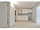 Basement area with white cabinets and countertops, open to other rooms at 389 Mill Creek Ne Bnd, Atlanta, GA 30307
