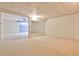Spacious finished basement featuring neutral carpet and access to other rooms at 389 Mill Creek Ne Bnd, Atlanta, GA 30307
