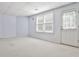 Finished basement featuring white walls, neutral carpet, and a door to the exterior at 389 Mill Creek Ne Bnd, Atlanta, GA 30307