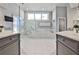 Elegant bathroom features marble countertops, a separate shower, and a luxurious soaking tub at 389 Mill Creek Ne Bnd, Atlanta, GA 30307