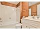 Bathroom featuring a tub with shower, wallpaper, and a vanity at 389 Mill Creek Ne Bnd, Atlanta, GA 30307