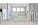 Spacious bathroom featuring marble walk-in shower and large soaking tub for a luxurious experience at 389 Mill Creek Ne Bnd, Atlanta, GA 30307