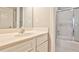 Bright bathroom featuring a tub with shower and a vanity with a solid surface countertop at 389 Mill Creek Ne Bnd, Atlanta, GA 30307