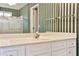 Bathroom features vanity with ample storage and a shower with glass door at 389 Mill Creek Ne Bnd, Atlanta, GA 30307