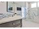 Bathroom features elegant marble countertop and tiling, providing a spa-like experience at 389 Mill Creek Ne Bnd, Atlanta, GA 30307
