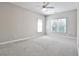 Large bedroom features neutral walls, plush carpeting and natural light from multiple windows at 389 Mill Creek Ne Bnd, Atlanta, GA 30307