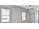 Bedroom featuring two windows with blinds, neutral walls, and a ceiling fan at 389 Mill Creek Ne Bnd, Atlanta, GA 30307