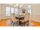 Elegant dining room featuring a modern chandelier and ample natural light at 389 Mill Creek Ne Bnd, Atlanta, GA 30307