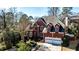 Charming two-story brick home featuring a well-manicured front yard and a two-car garage at 389 Mill Creek Ne Bnd, Atlanta, GA 30307