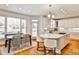 Open-concept kitchen featuring a center island with seating and a dining area near large windows at 389 Mill Creek Ne Bnd, Atlanta, GA 30307