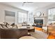 Well-lit living room with hardwood floors, neutral decor, and a fireplace with a white mantel at 389 Mill Creek Ne Bnd, Atlanta, GA 30307