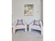 Stylish sitting area showcases two chairs and modern artwork over plush carpeting at 389 Mill Creek Ne Bnd, Atlanta, GA 30307