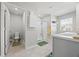 Bright bathroom featuring a shower, toilet, and vanity with a sink, offering a clean and functional space at 529 Azalea Bloom Dr, Loganville, GA 30052