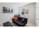 Bedroom with a black futon, desk area, and neutral carpet at 529 Azalea Bloom Dr, Loganville, GA 30052