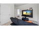 Bedroom featuring a wall-mounted television and a large doorway to another room at 529 Azalea Bloom Dr, Loganville, GA 30052