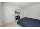 Bedroom showcasing a TV, closet, and comfortable bed, ideal for relaxation and entertainment at 529 Azalea Bloom Dr, Loganville, GA 30052