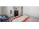 Bright bedroom with a soft chair, a dresser, and a comfortable bed at 529 Azalea Bloom Dr, Loganville, GA 30052