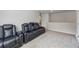 Inviting bonus room featuring comfortable reclining seats, ideal for relaxation and entertainment at 529 Azalea Bloom Dr, Loganville, GA 30052