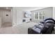 Bright bonus room featuring a large TV and reclining seating, perfect for entertainment and relaxation at 529 Azalea Bloom Dr, Loganville, GA 30052