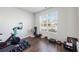 Bright exercise room with natural light, hardwood floors, and space for fitness equipment at 529 Azalea Bloom Dr, Loganville, GA 30052