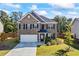 Charming two-story home with a brick facade, well-maintained landscaping, and a two-car garage at 529 Azalea Bloom Dr, Loganville, GA 30052