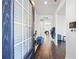 Inviting foyer with hardwood floors, natural light, and a glimpse into the open-concept living spaces at 529 Azalea Bloom Dr, Loganville, GA 30052
