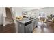Open kitchen with granite countertops, stainless steel appliances, and seamless access to the living area at 529 Azalea Bloom Dr, Loganville, GA 30052