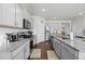 Beautiful kitchen with granite countertops, stainless steel appliances, and sleek gray cabinetry at 529 Azalea Bloom Dr, Loganville, GA 30052