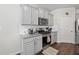 Modern kitchen with granite countertops, stainless steel appliances, and sleek gray cabinetry at 529 Azalea Bloom Dr, Loganville, GA 30052